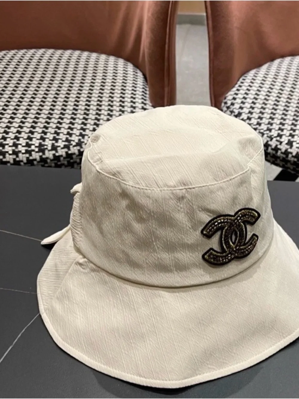 CHANEL Cream Bucket Hat with Black and Gold CC Logo